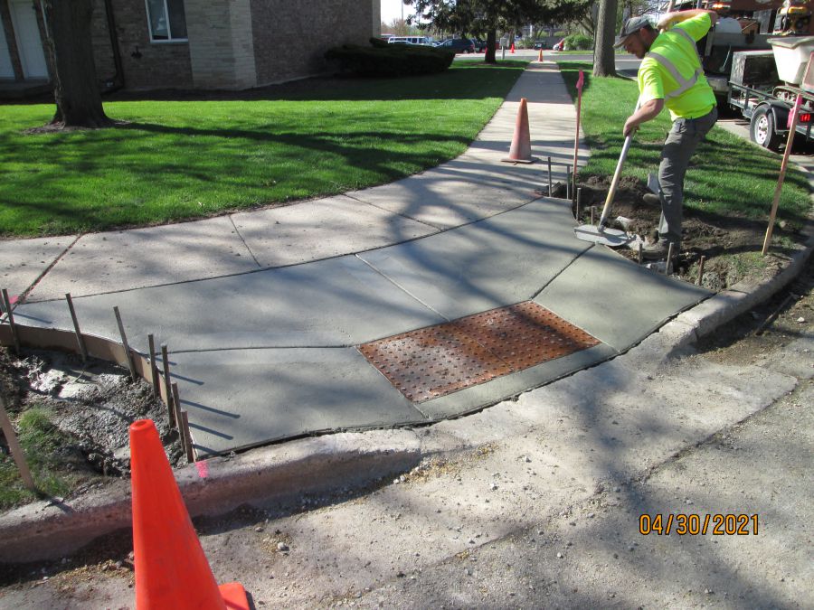 Cutting in Joints Sidewalk Replacement Photo