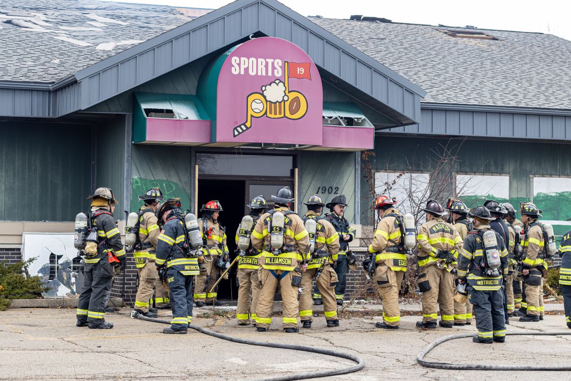 Firefighters assemble outside Callahan's Sports Pub property