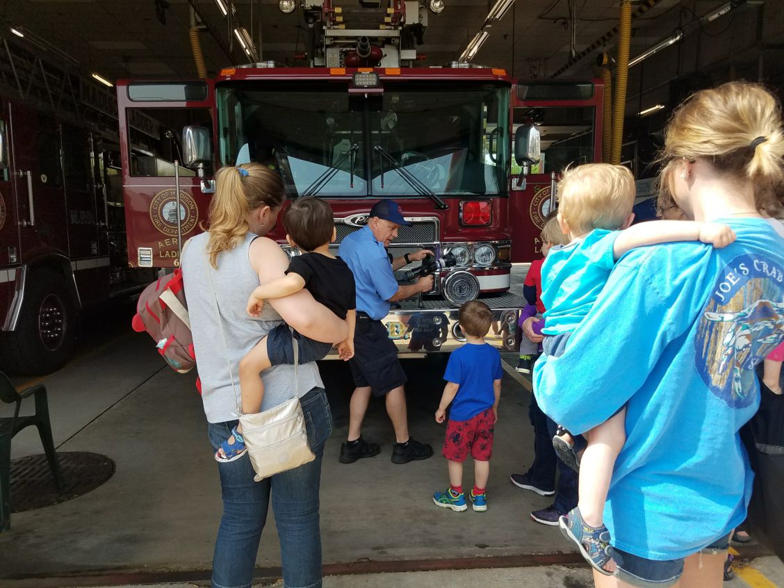 Firefighter Berridge shows kids the fire truck
