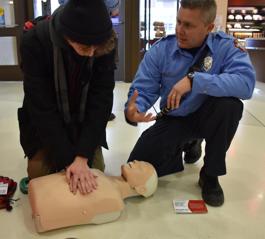 Lt. McCartney and UW student practicing CPR