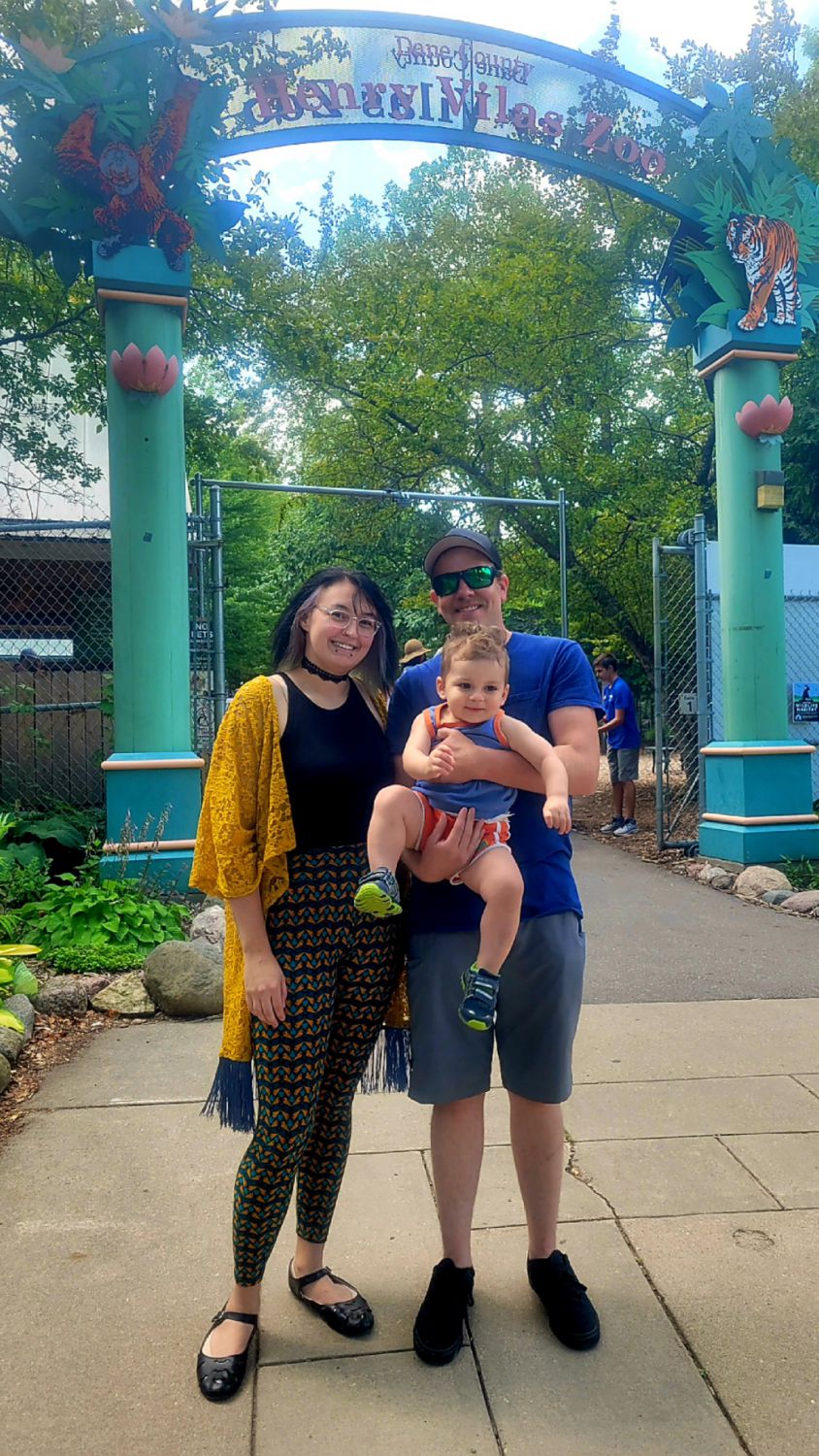 Blake Scoville with wife Aryn and son Cain at the entrance to Henry Vilas Zoo