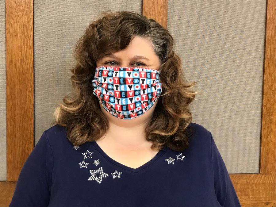 City Clerk Maribeth Witzel-Behl wearing a "Vote" mask