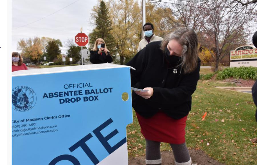 Mayor Satya using a ballot drop box
