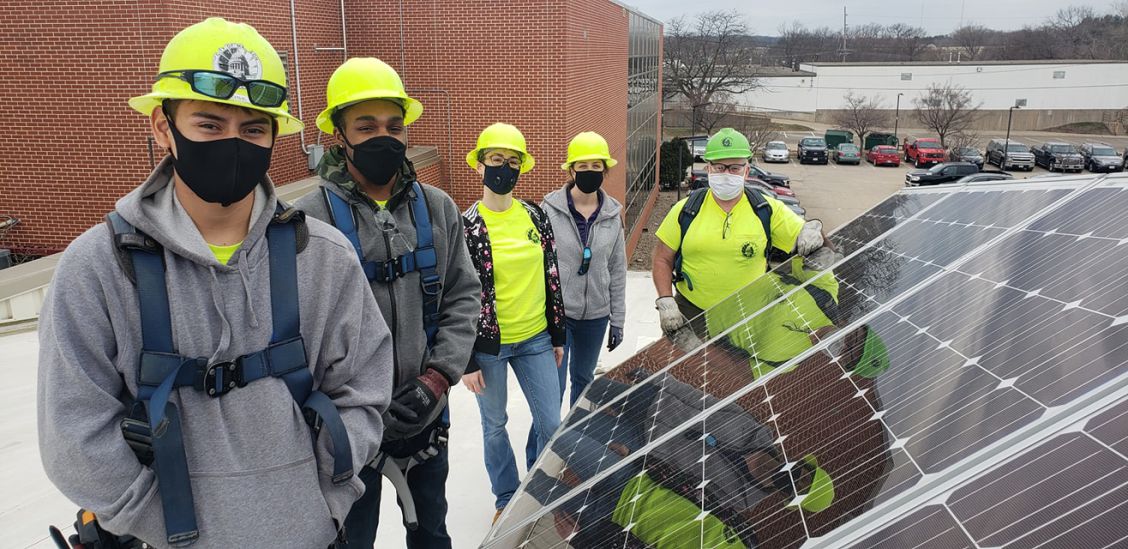 Madison Engineering staff with solar panels