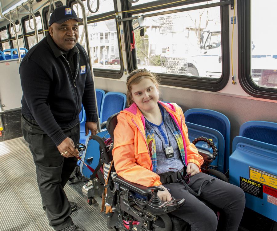 Driver securing wheelchair on Metro's fixed-route bus