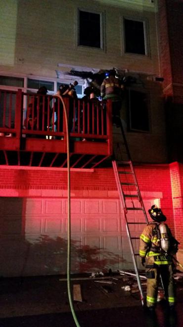 Firefighters check on balcony