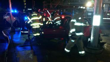 Firefighters stabilizing vehicle