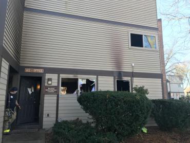 Broken windows and smoke damage outside rental office