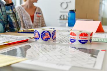 I Voted and Future Voter stickers on table at polling place
