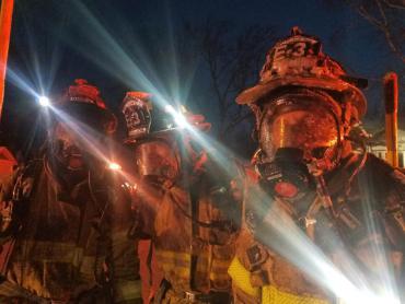 Firefighters are covered with ice after fighting Buckeye fire.