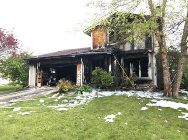 View of home from the front with fire damage