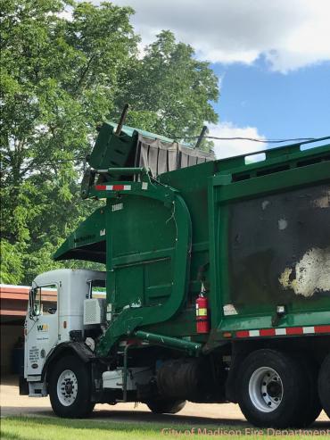 Dumpster in contact with electrical wires