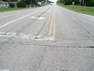 Photo shows deteriorating pavement on Cottage Grove Road.