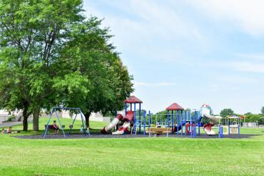 small, colorful child's playground with slides at Reindahl Park