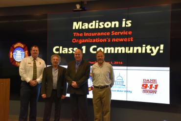 Chief Davis, Mayor Soglin, Dane County 911 Asst. Operations Manager Kevin Fosso, and Madison Water Utility GM Tom Heikkinen