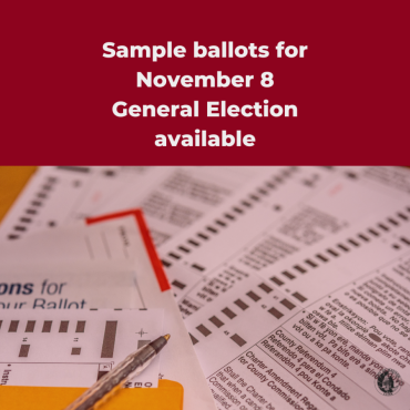 Red square graphic with white text that reads, "Sample ballots for November 8 General Election available." Image of a ballot packet ready for voting is in the bottom half of the graphic.