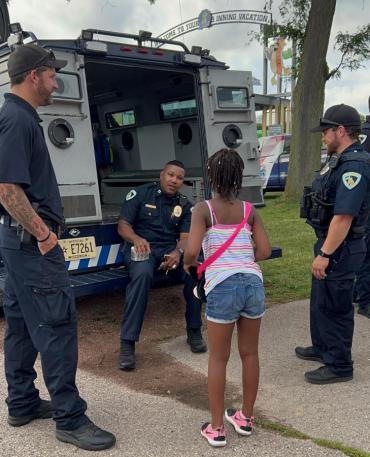 Officers connect with a child during the 2022 National Night Out event at Warner Park.