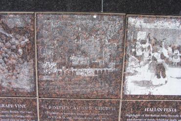 Detail of Spirit of Greenbush granite image and story panel showing how unreadable the stones in the base became over time.