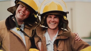 Firefighter Karen Hoffman and Firefighter Pamela Jacobson smiling, side by side