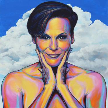 Photo realistic portrait of Alexandra Billings, painted using rainbow colors. Alexandra is only visible above the chest, and she has her chin resting in her hands. The background is blue with white puffy clouds.