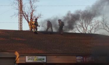 Firefighters ventilating the building.