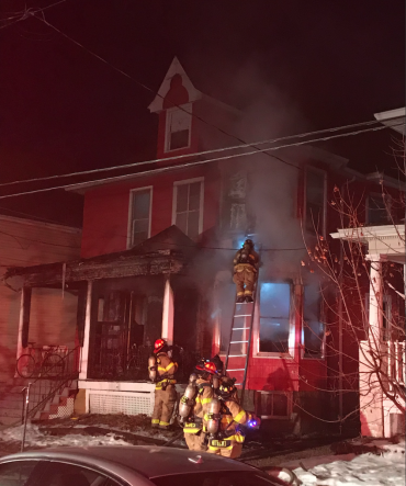 Firefighters in front of house on Franklin Street