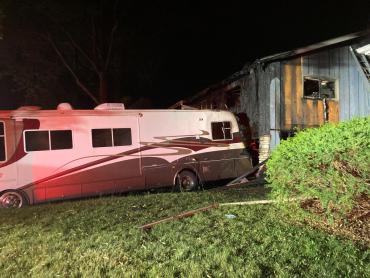 Recreational vehicle and home damaged by fire. 