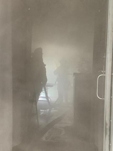 Firefighters inside smoky railroad car