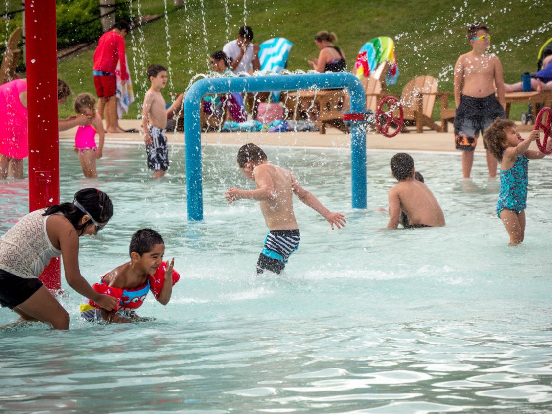 Kids splashing in the water at Goodman Pool