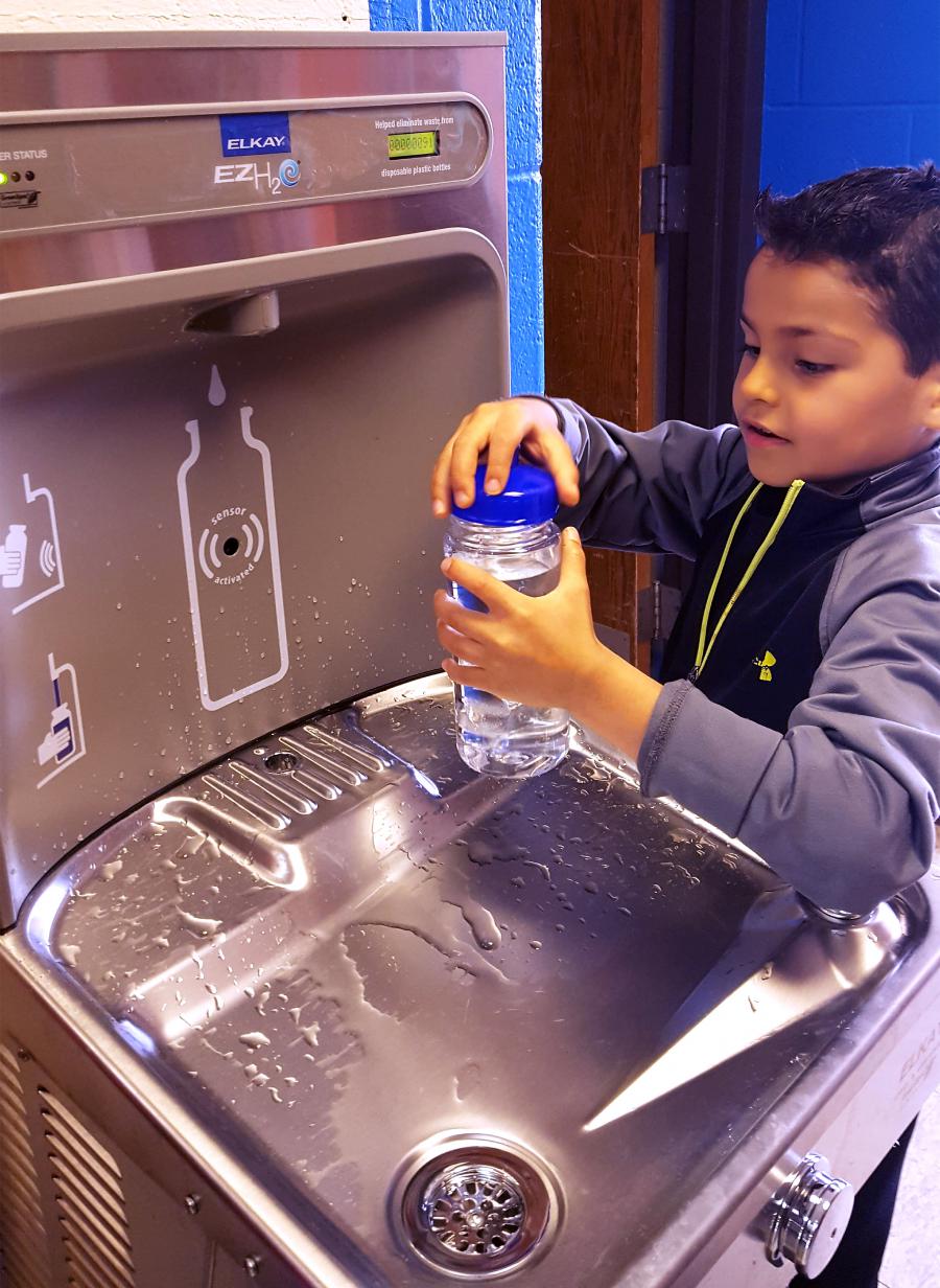 Student filling bottle at Thoreau Elementary