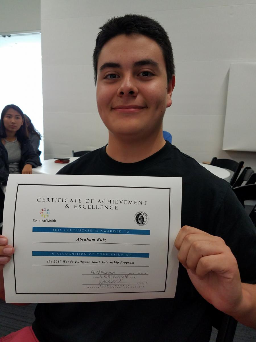 Abe Ruiz with certificate of achievement