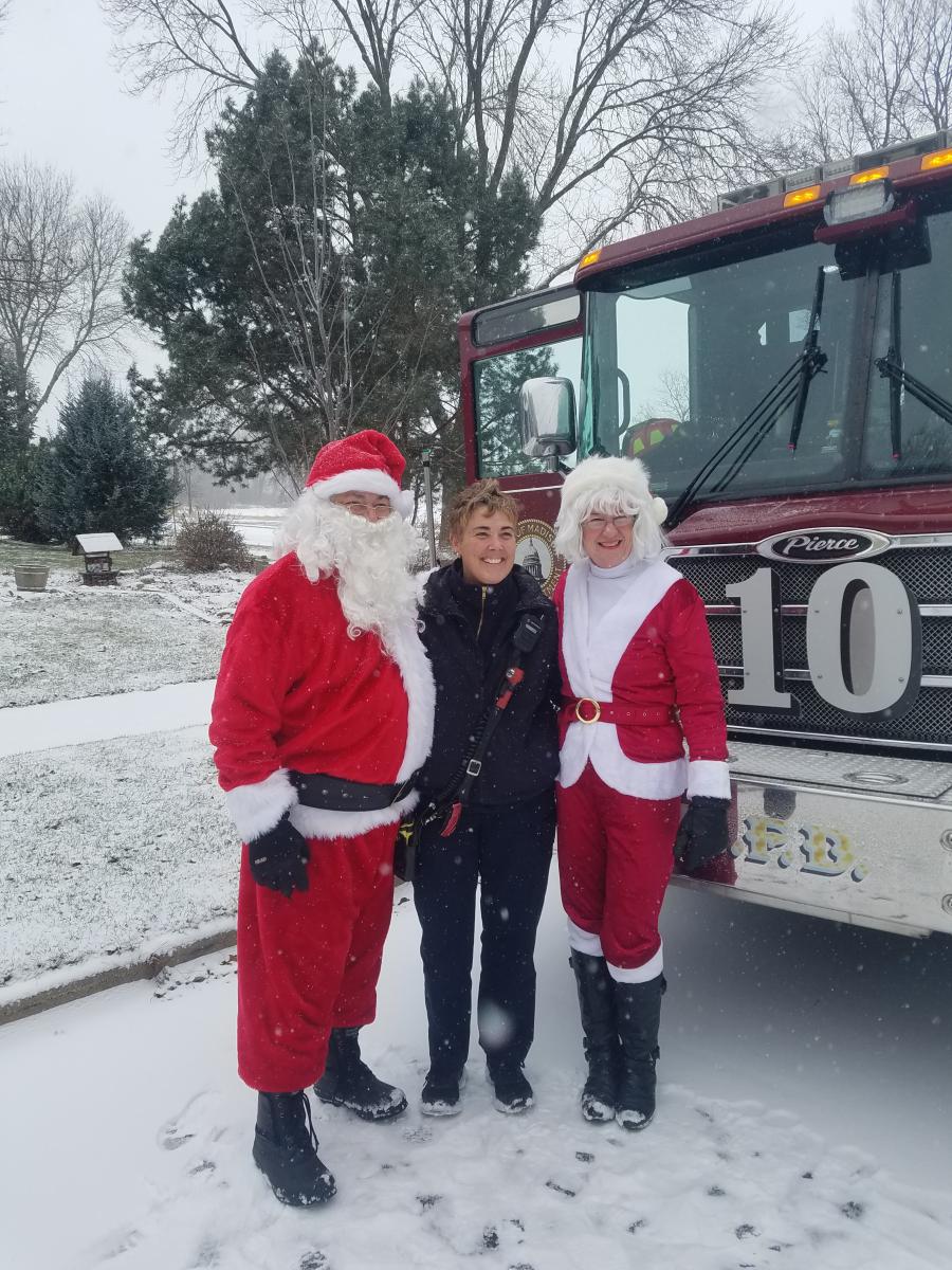 Lt. Lisa Becher with Santa and Mrs. Claus
