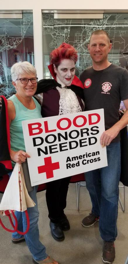 Blood Donors with American Red Cross sign