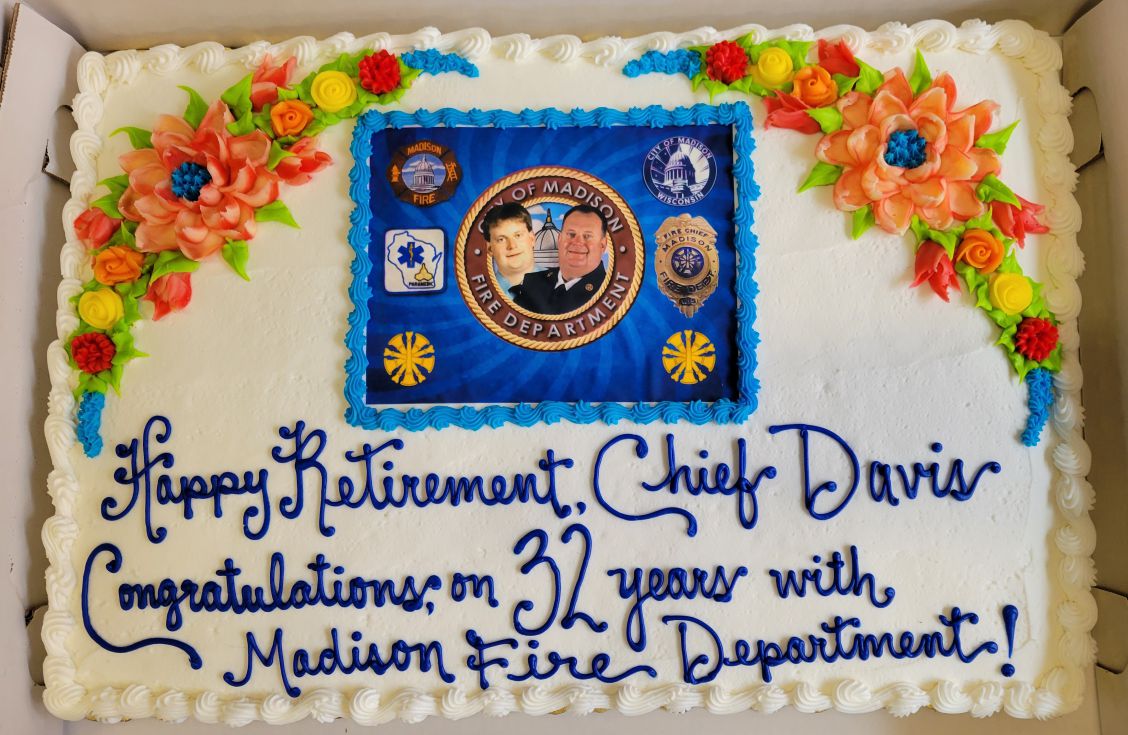 Decorated cake that says "Happy Retirement, Chief Davis. Congratulations on 32 years with the Madison Fire Department!"