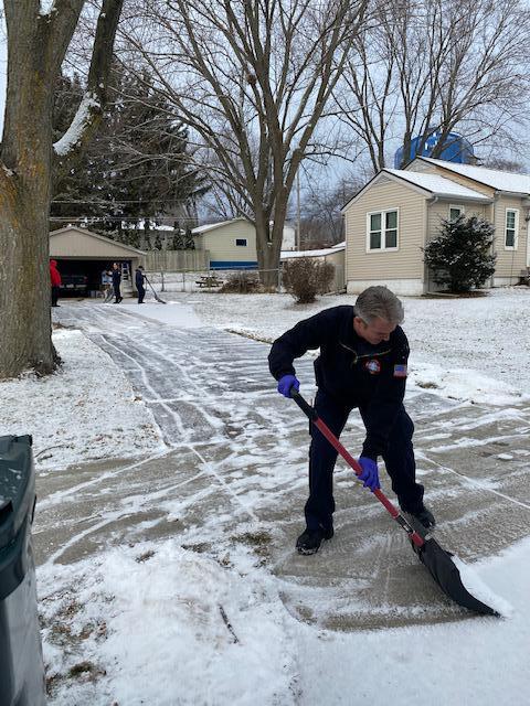 Station 5 crew shoveling driveway