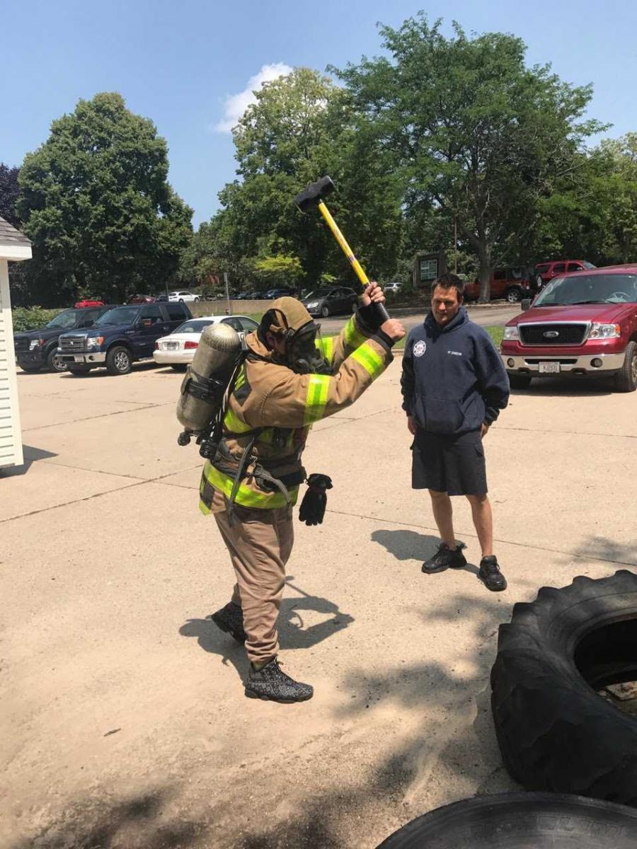 Abe Ruiz takes a sledge hammer to a tire