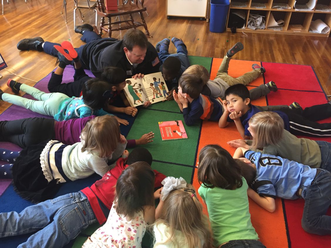 Chief Davis reading to elementary school children