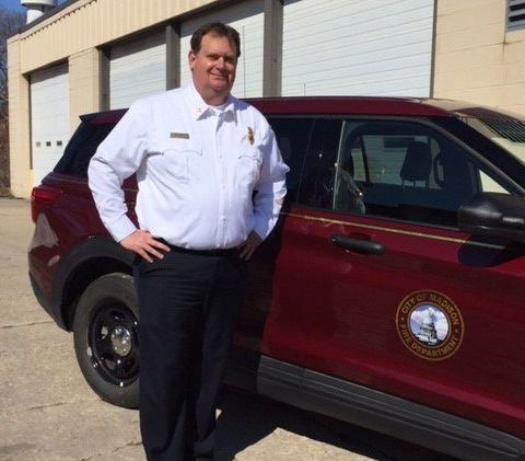 Chief Davis standing next to his Fire SUV