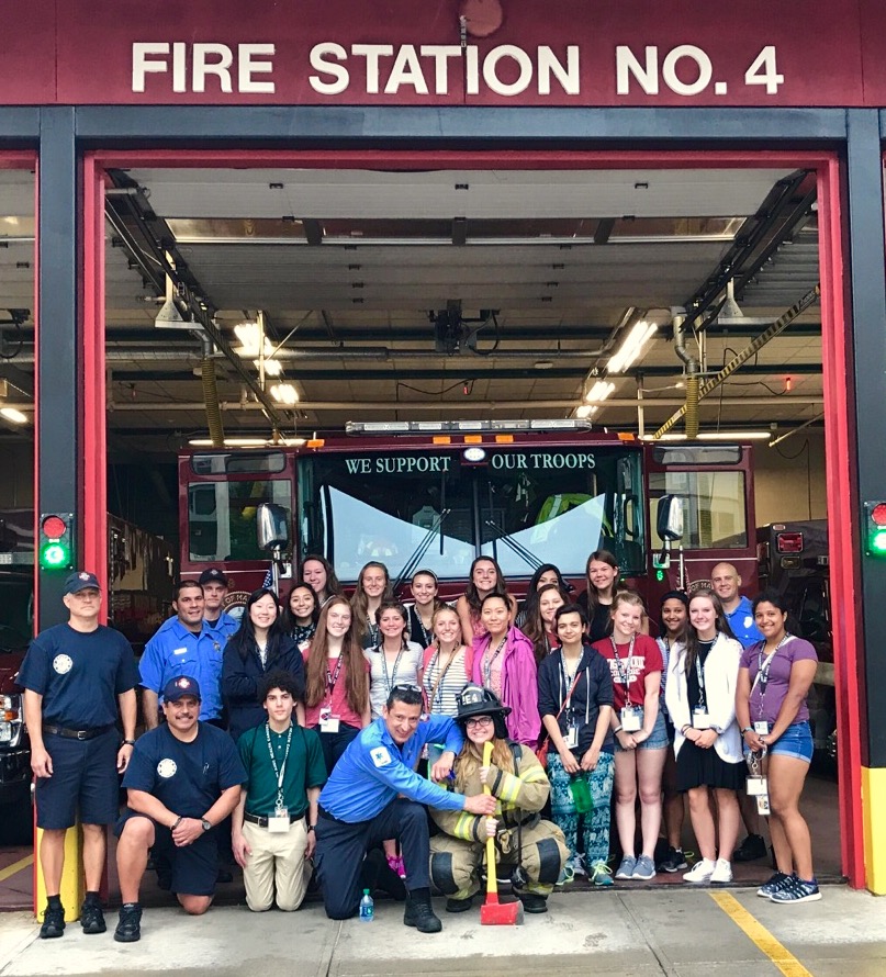 Campers with firefighters and paramedics at Station 4
