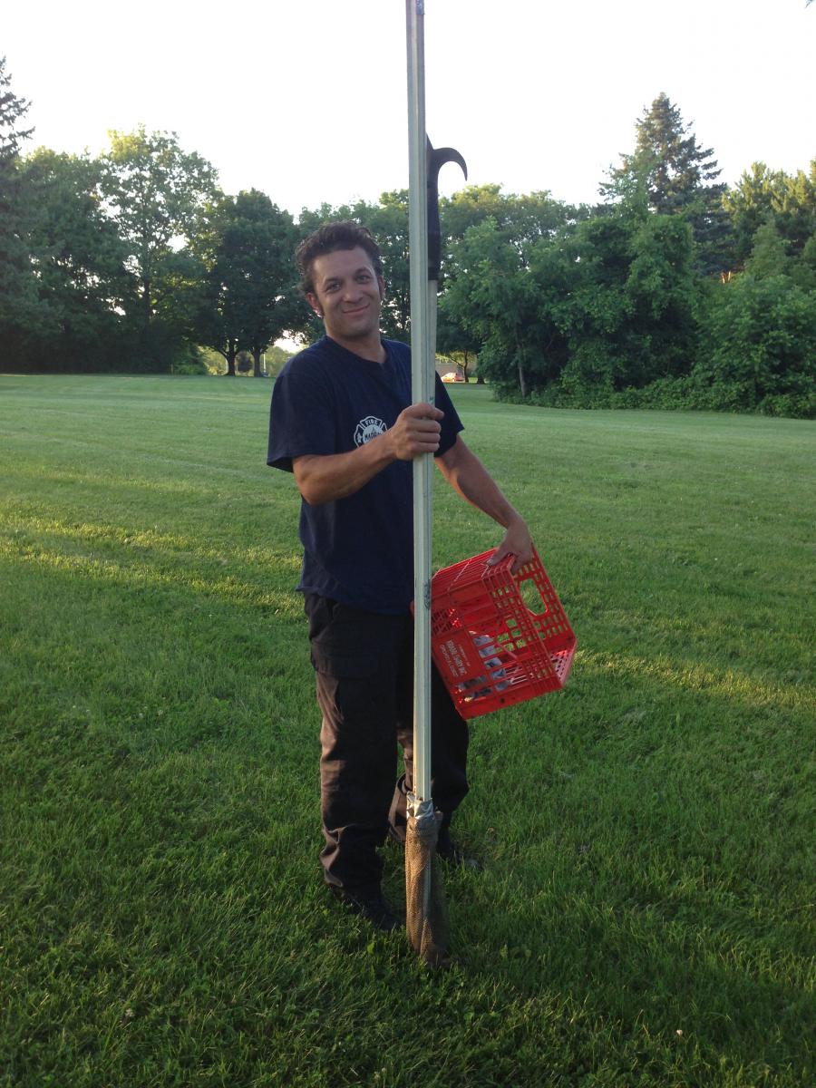 Firefighter Jadon Beehner with pike pole and milk crate