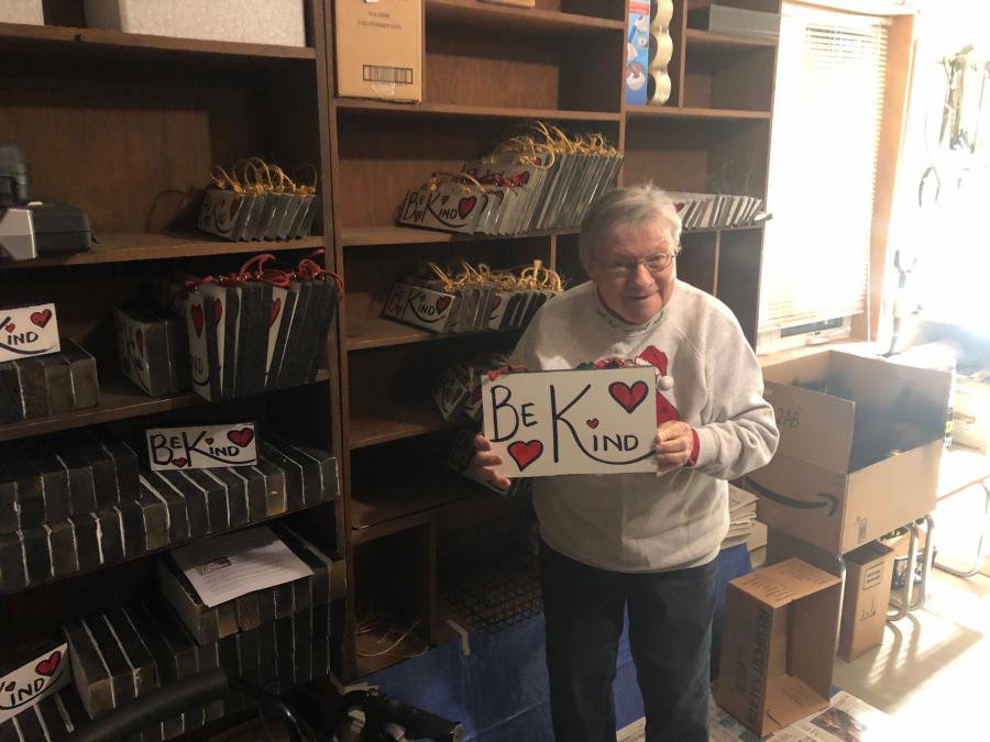 Doris with "Be Kind" signs