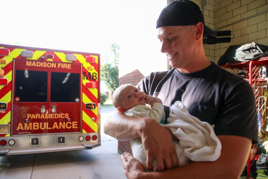 Paramedic Jonathan Braun with baby Simon