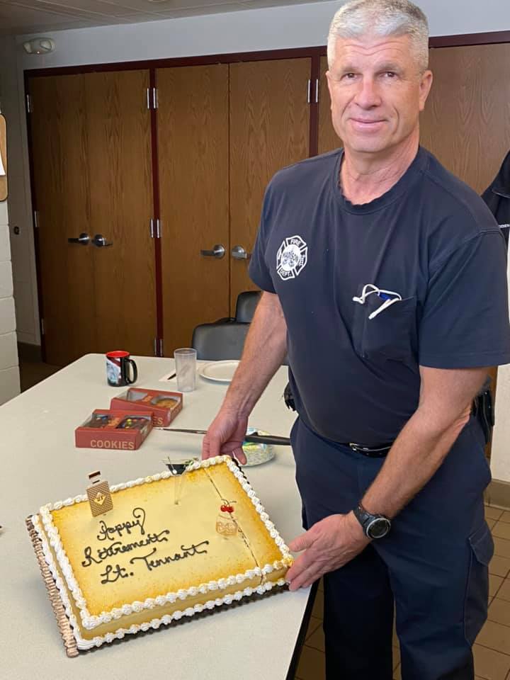 Lt. Steve Tennant with cake on his last day at the firehouse