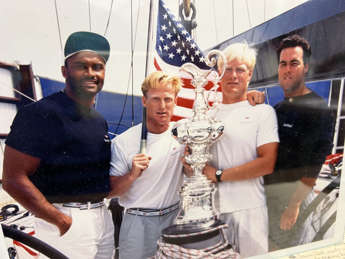 Art Price with his America's Cup team and trophy, 1990