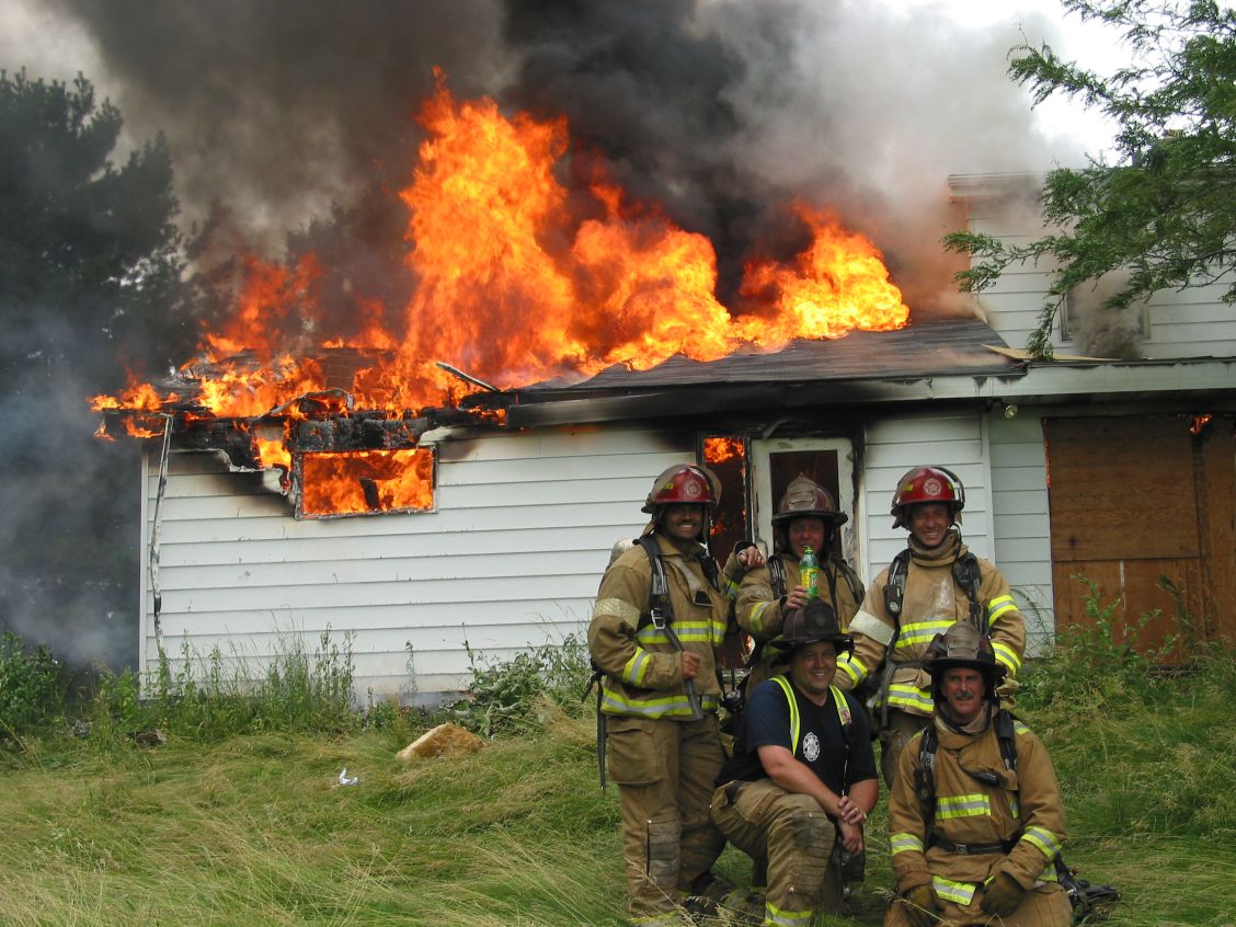 Patrick Tomko and his fellow training officers in front of a training burn