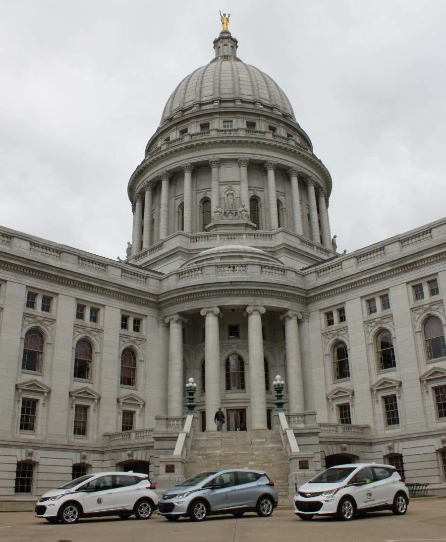 Three Chevy Bolts in front of Capitol