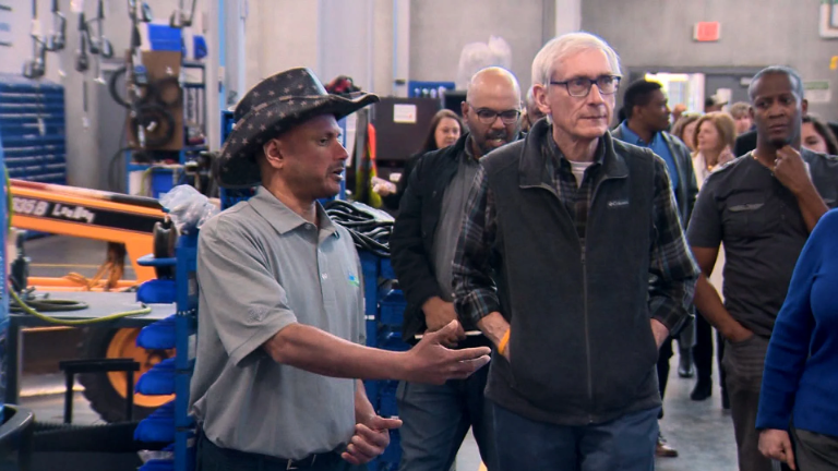 Mahanth Joishy shows Governor Evers City of Madison's Fleet HQ