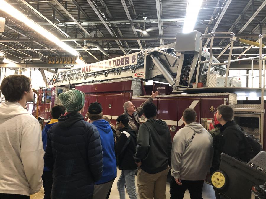 Students see a fire engine needing repairs
