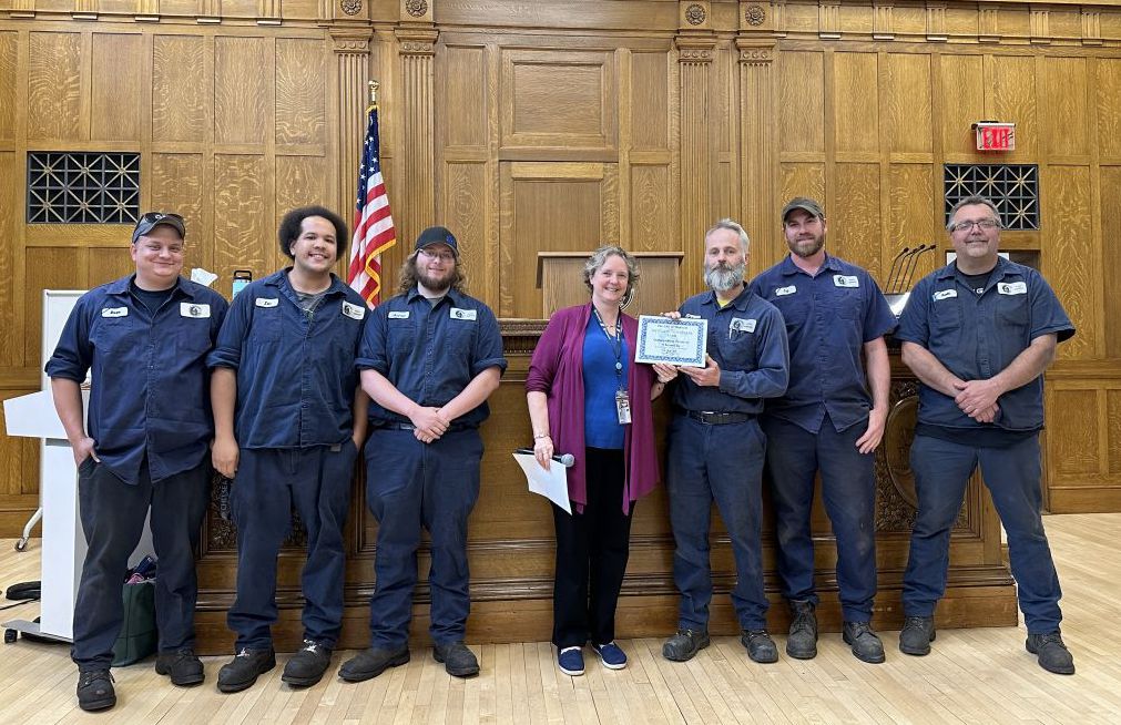 Fleet satellite technicians standing with Mayor Rhodes-Conway at the TeamCity award ceremony