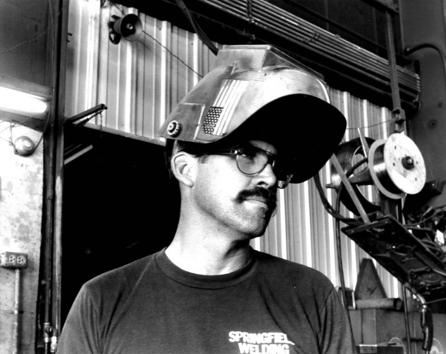 Gary Acker wearing a welding helmet